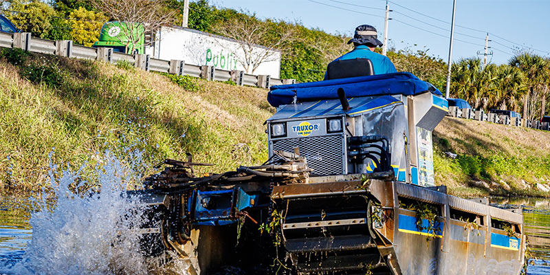 Rear view of a Truxor aquatic machine cruising through a canal